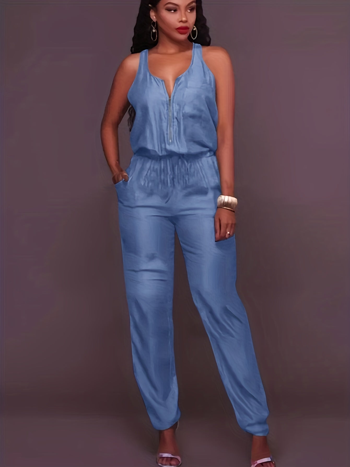 Denim jumpsuit with zipper at the front and waistband