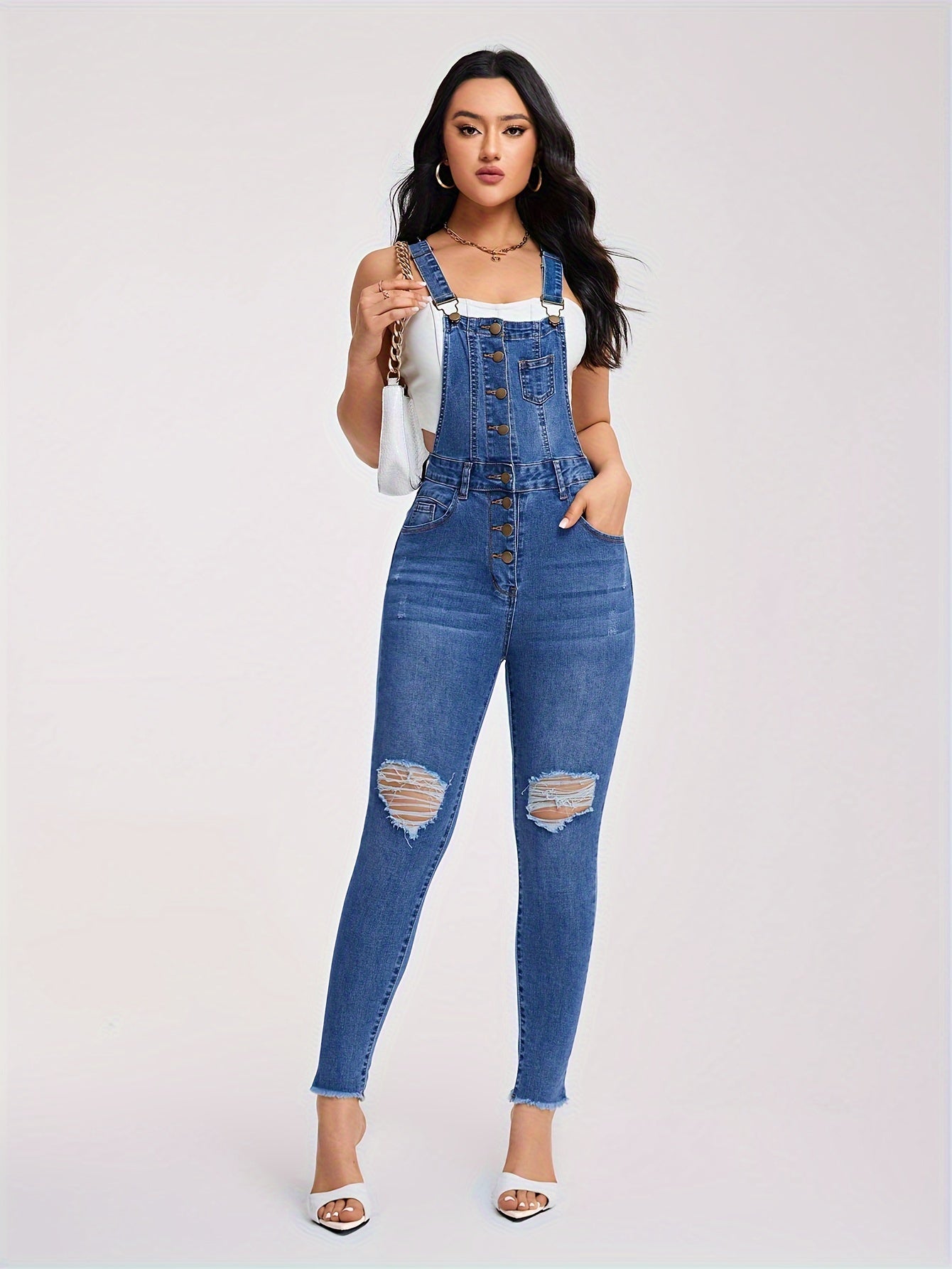 Torn denim overalls with half buttons