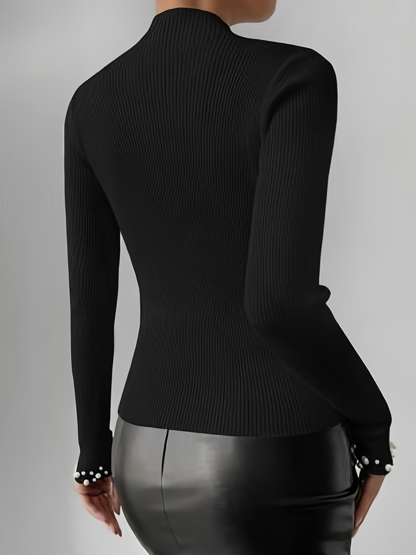 Sweater with high collar and pearl decoration