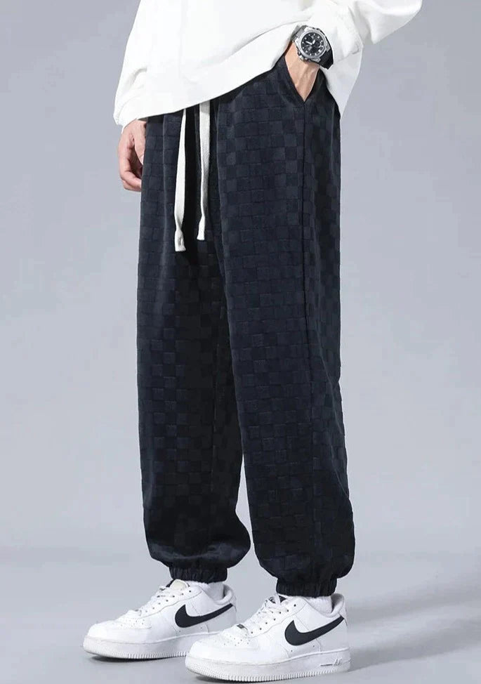 Wide sports pants with checkerboard pattern