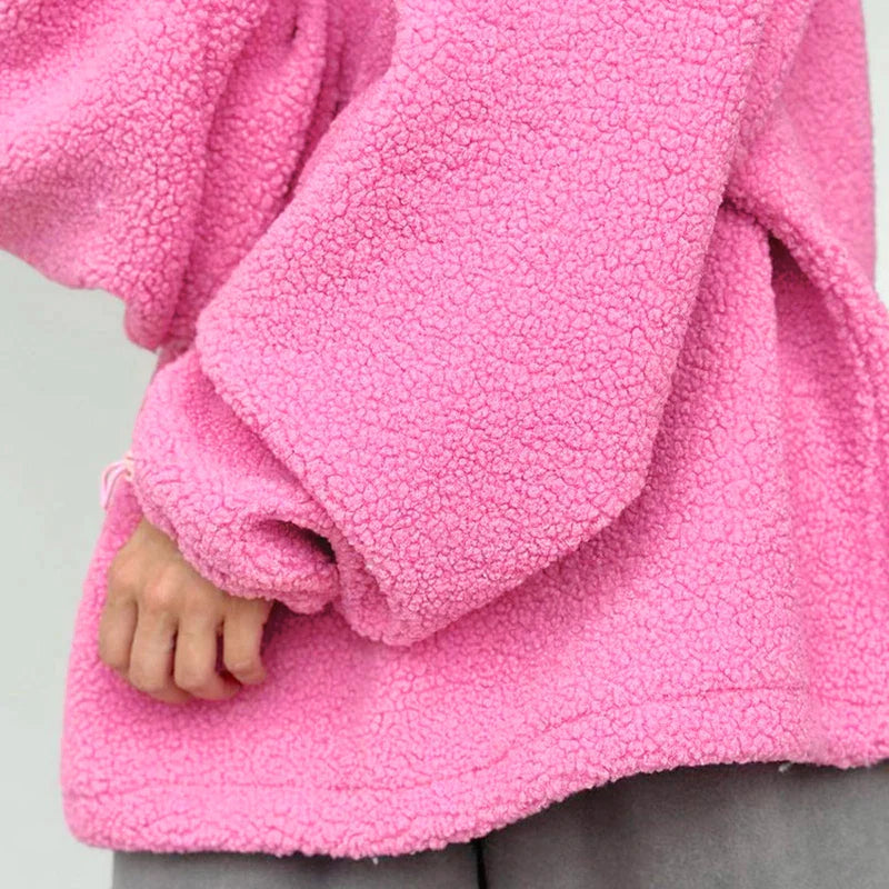 Pink sweater made of knitted lamb fleece