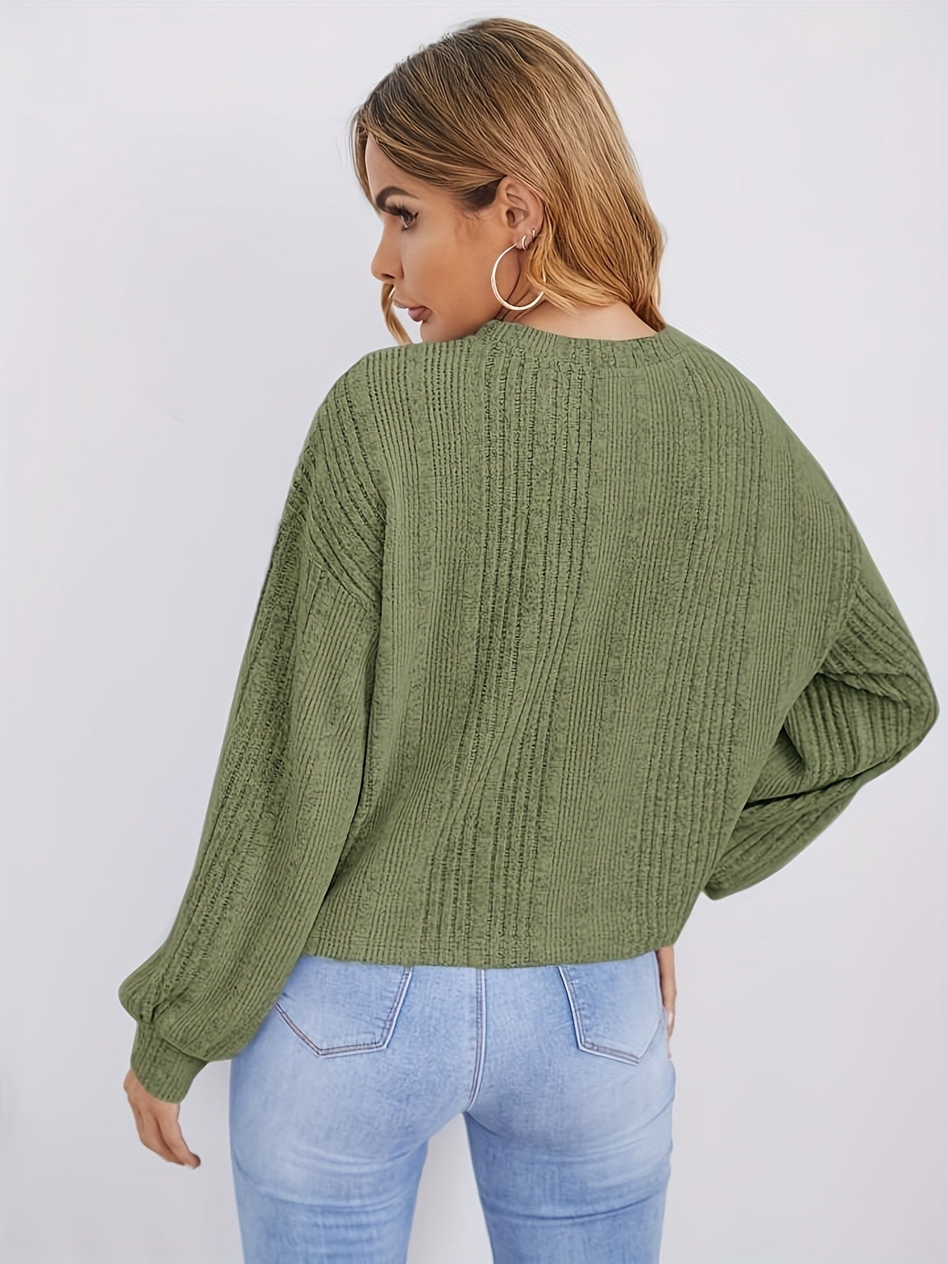 Ribbed sweater with round neck and pearl decoration