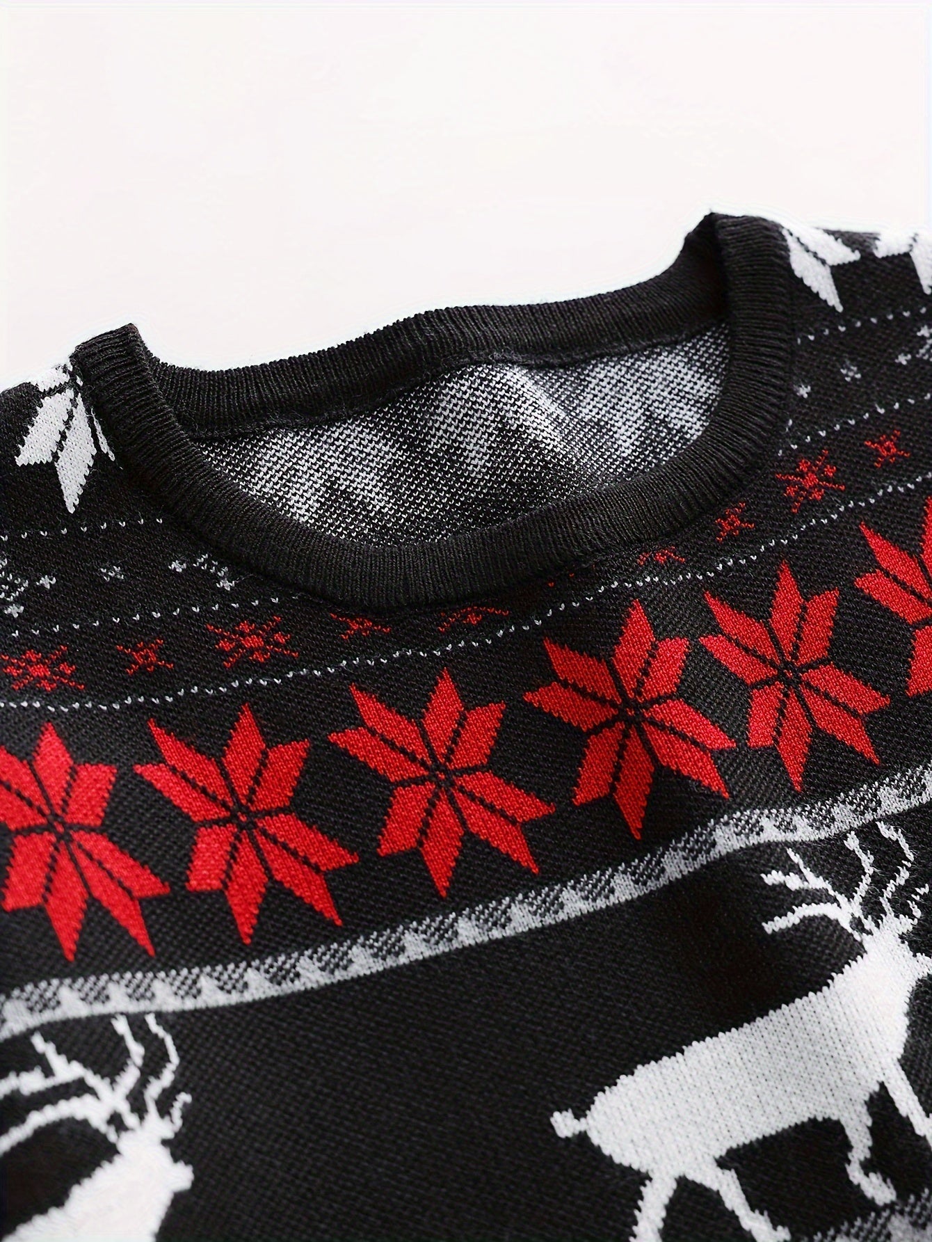 Knitted cable sweater with Christmas pattern