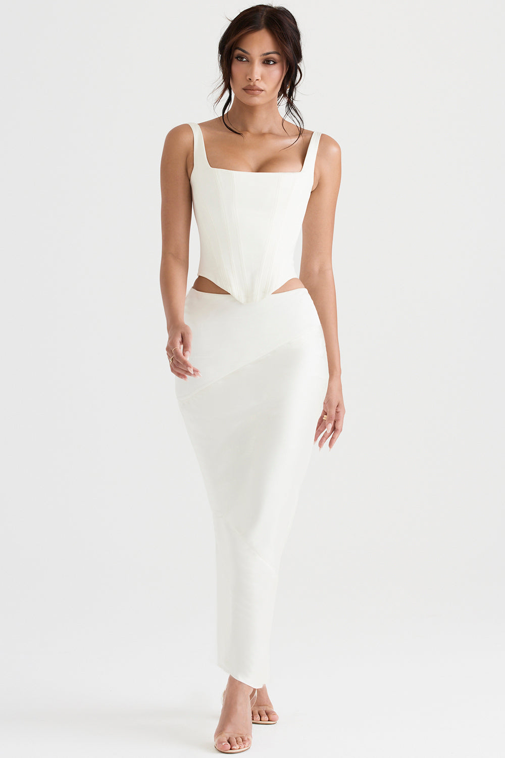 Long ivory satin corset with diagonally cut midi skirt