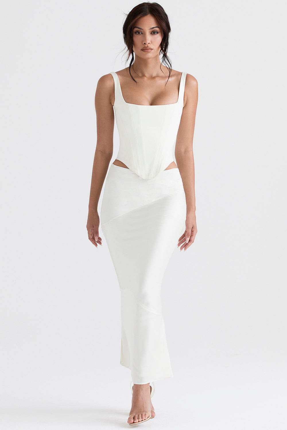 Long ivory satin corset with diagonally cut midi skirt