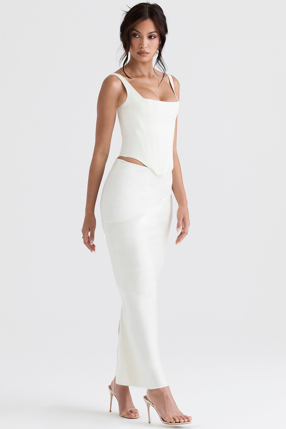 Long ivory satin corset with diagonally cut midi skirt