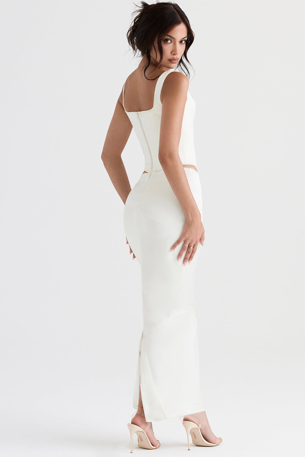 Long ivory satin corset with diagonally cut midi skirt