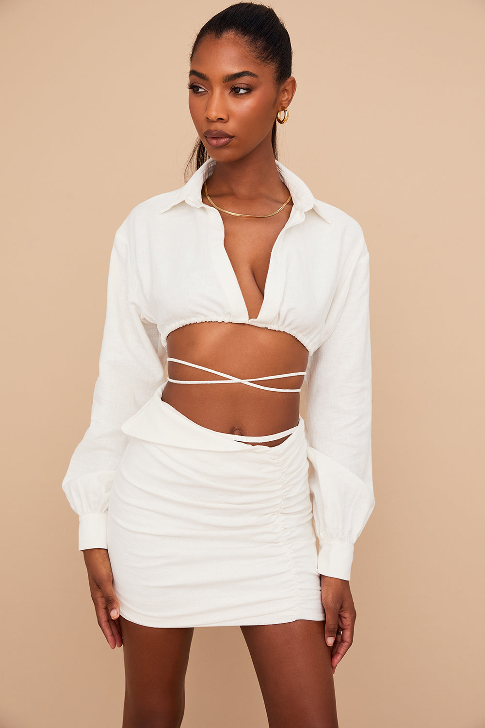 Off-white cropped wrap shirt with folded waist mini skirt