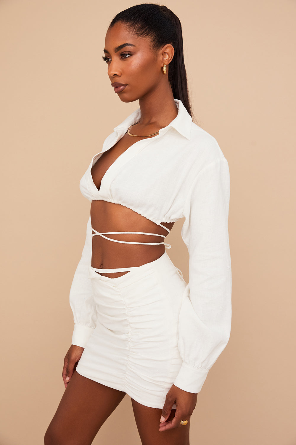 Off-white cropped wrap shirt with folded waist mini skirt