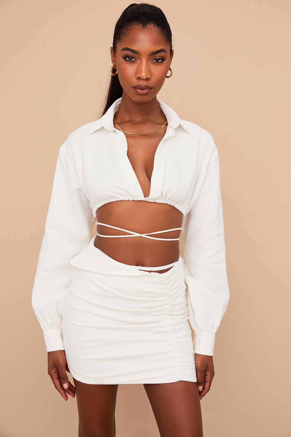 Off-white cropped wrap shirt with folded waist mini skirt