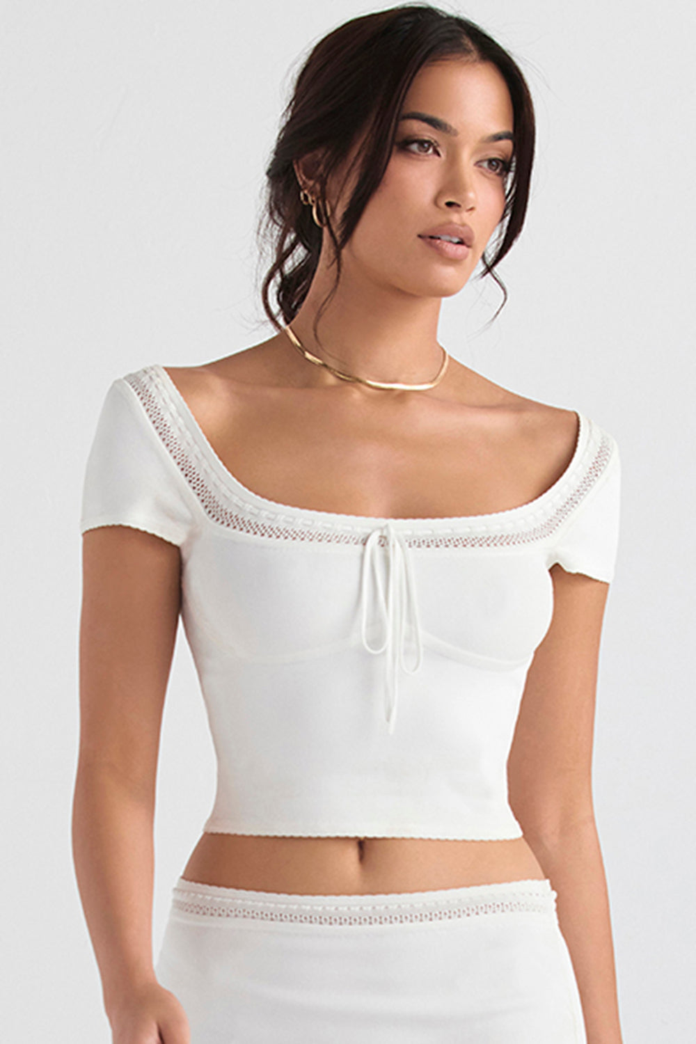 Ivory colored elegant rib knitted top with mini skirt