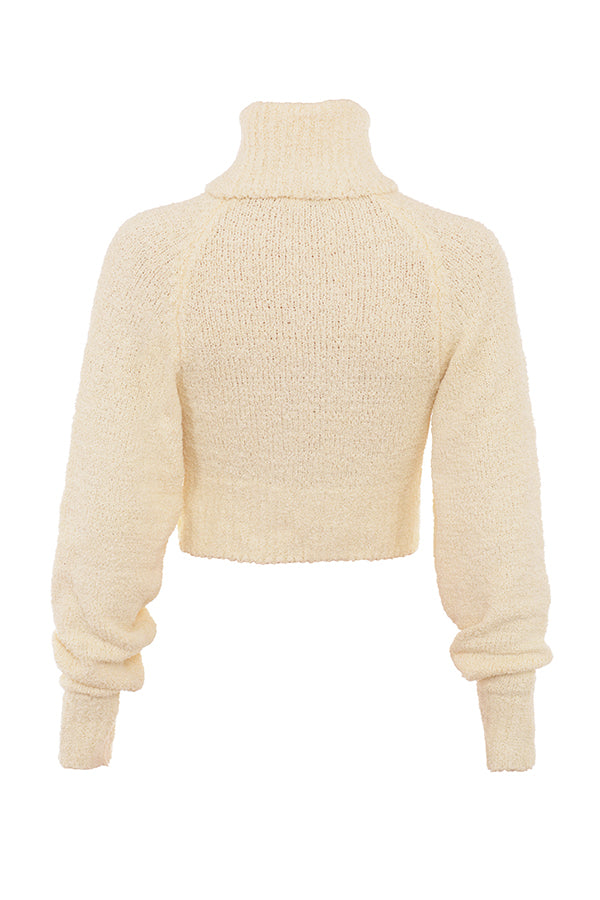 Cream-colored soft boucléknitted cropped sweater with midi skirt