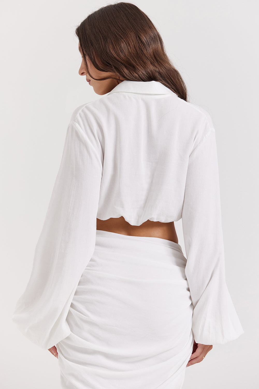 White deep blouson top with pleated maxi skirt