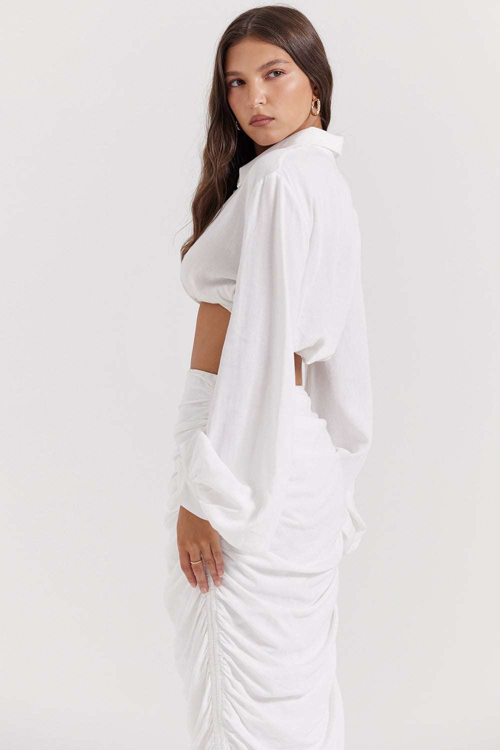 White deep blouson top with pleated maxi skirt