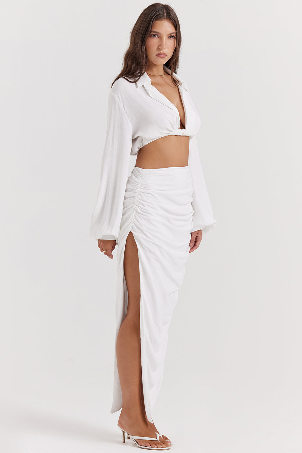 White deep blouson top with pleated maxi skirt