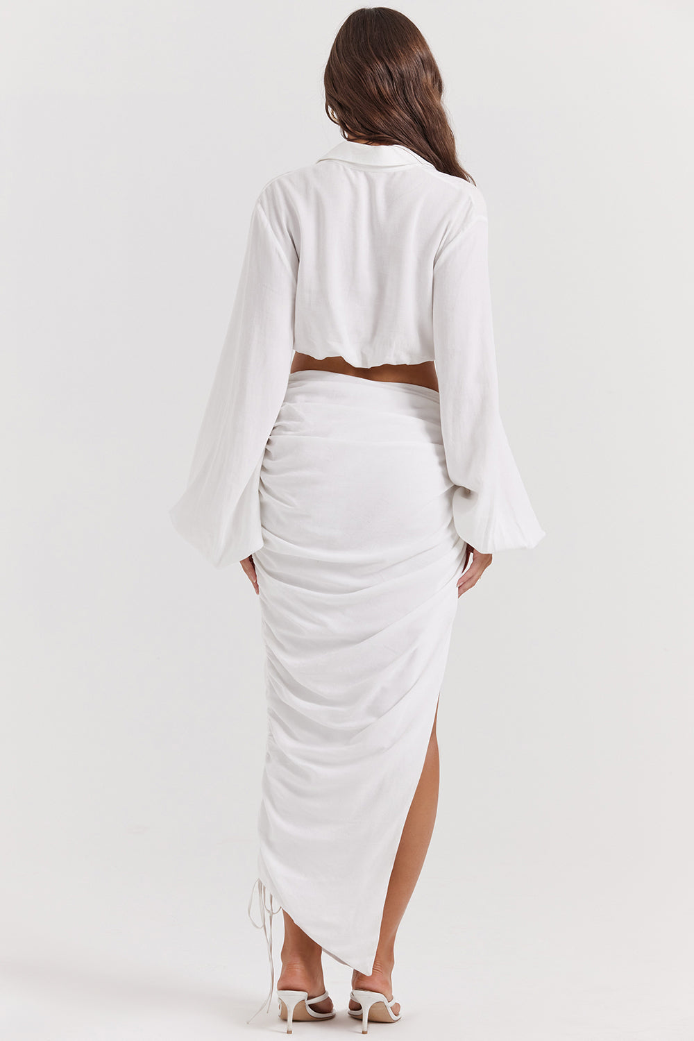 White deep blouson top with pleated maxi skirt