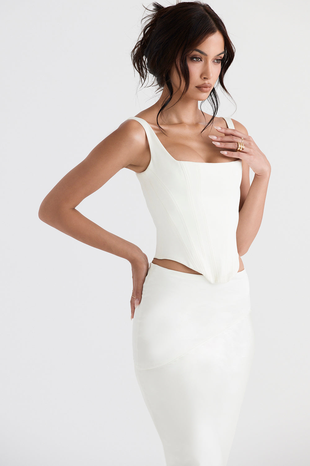 Long ivory satin corset with diagonally cut midi skirt