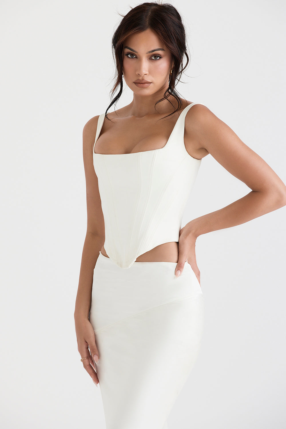 Long ivory satin corset with diagonally cut midi skirt