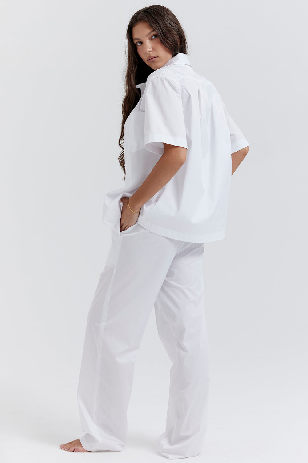 White oversized shirt with relaxed fit trousers