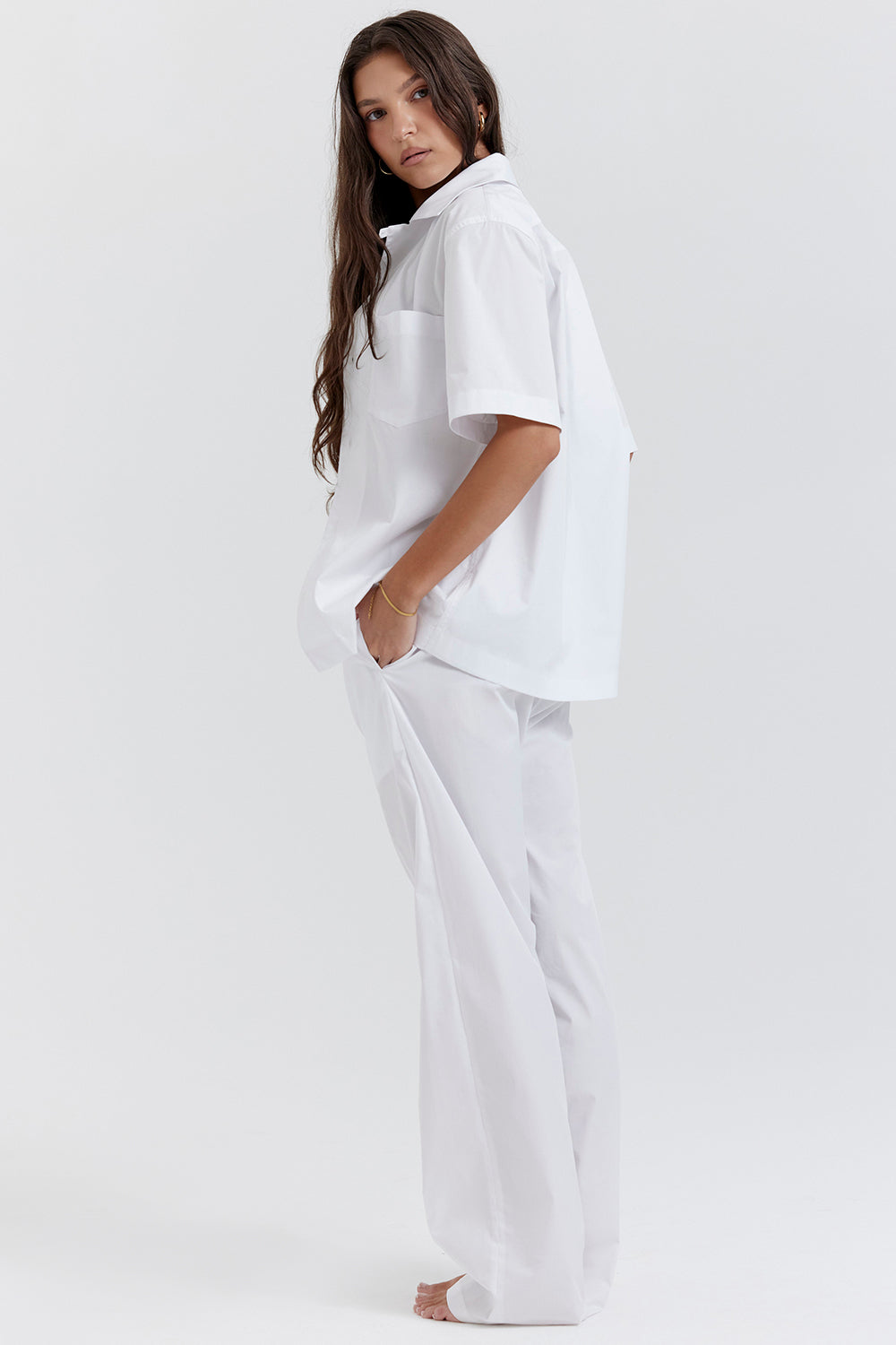 White oversized shirt with relaxed fit trousers