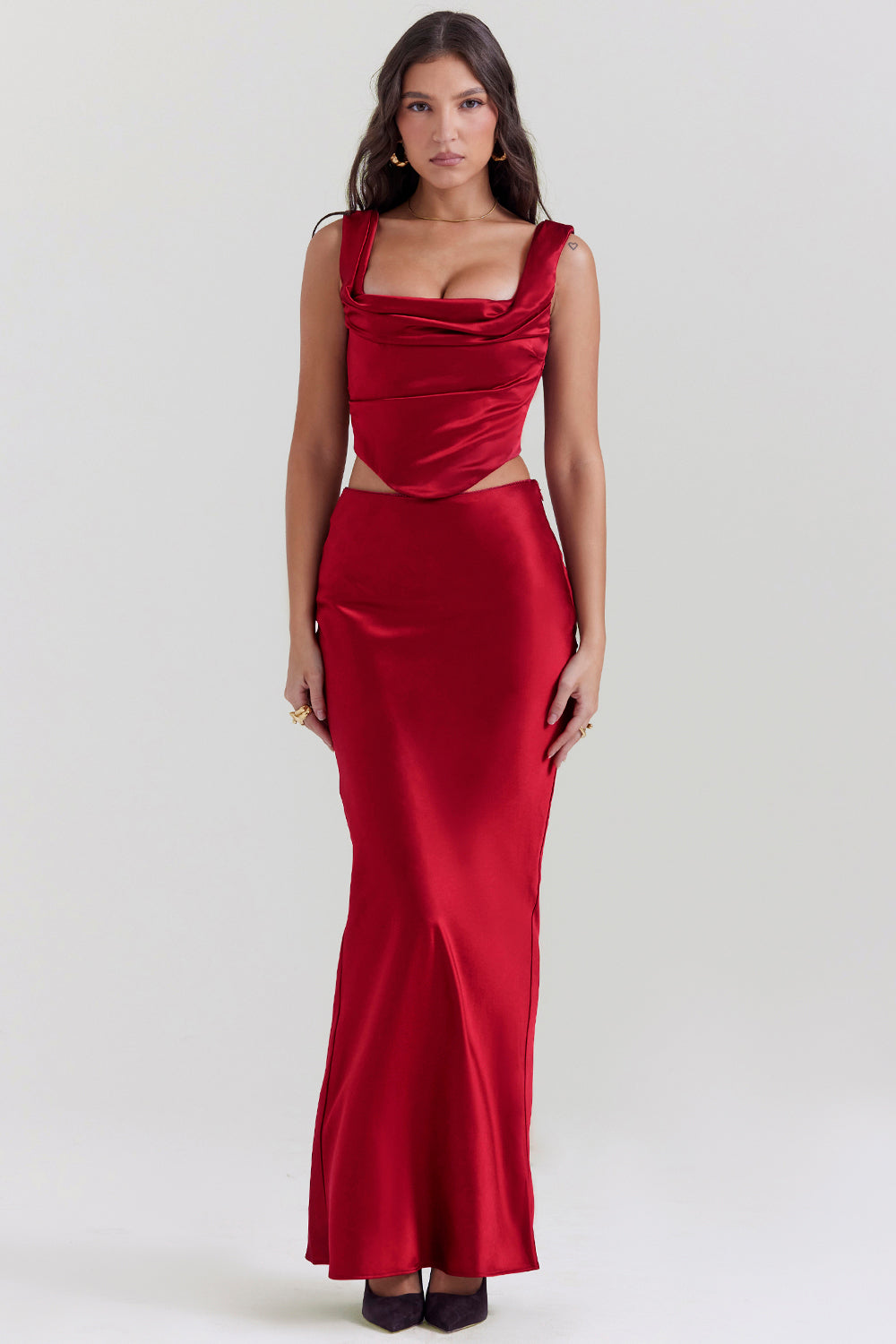 Set of ruby red corset with lace back and diagonally cut satin maxi skirt