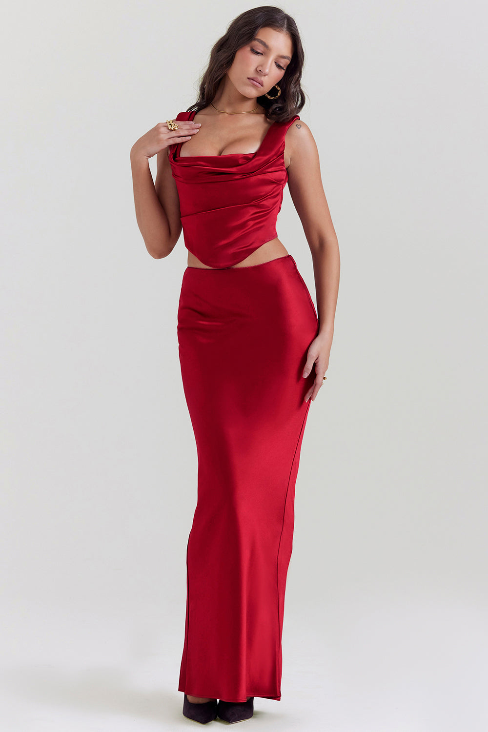 Set of ruby red corset with lace back and diagonally cut satin maxi skirt