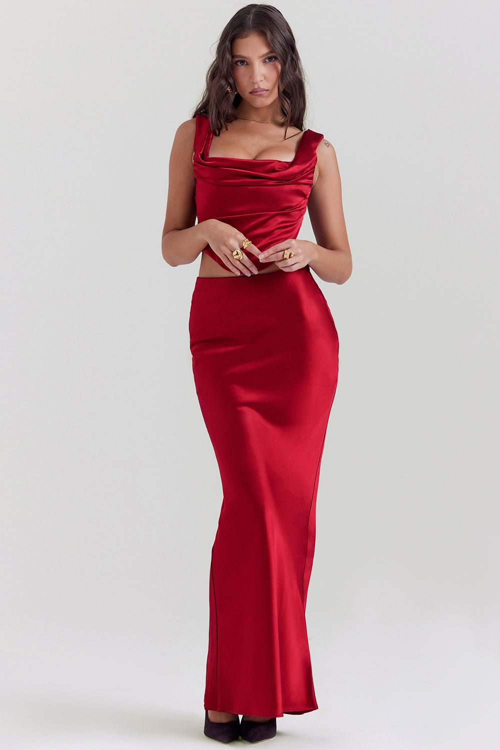 Set of ruby red corset with lace back and diagonally cut satin maxi skirt