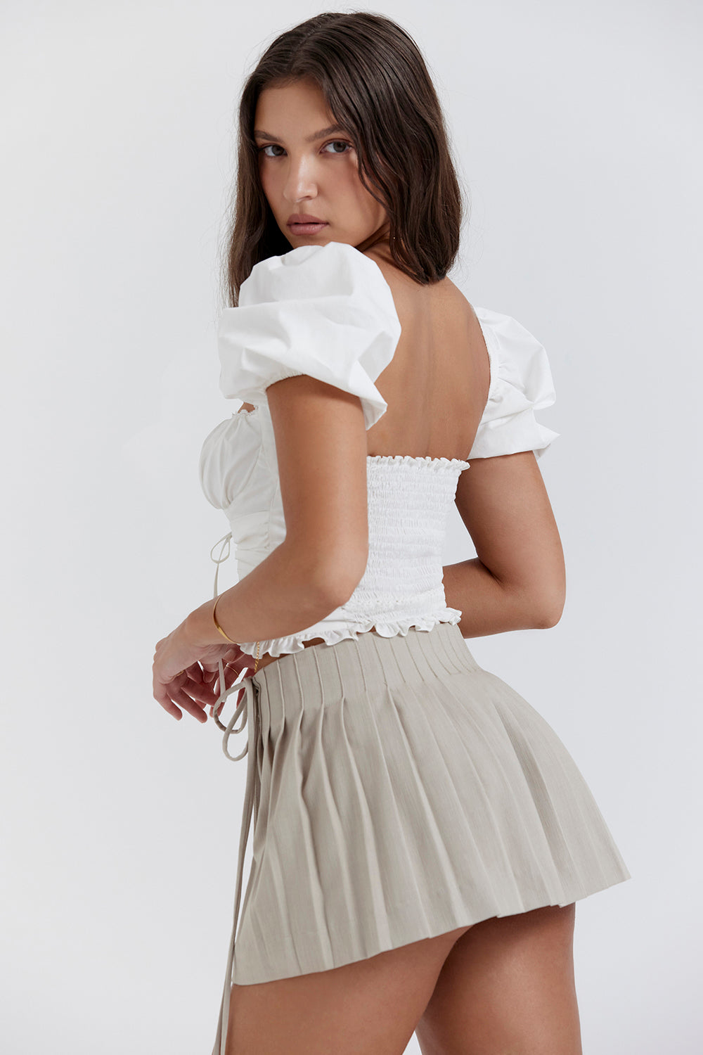 White pleated top with Stone pleated mini wrap skirt