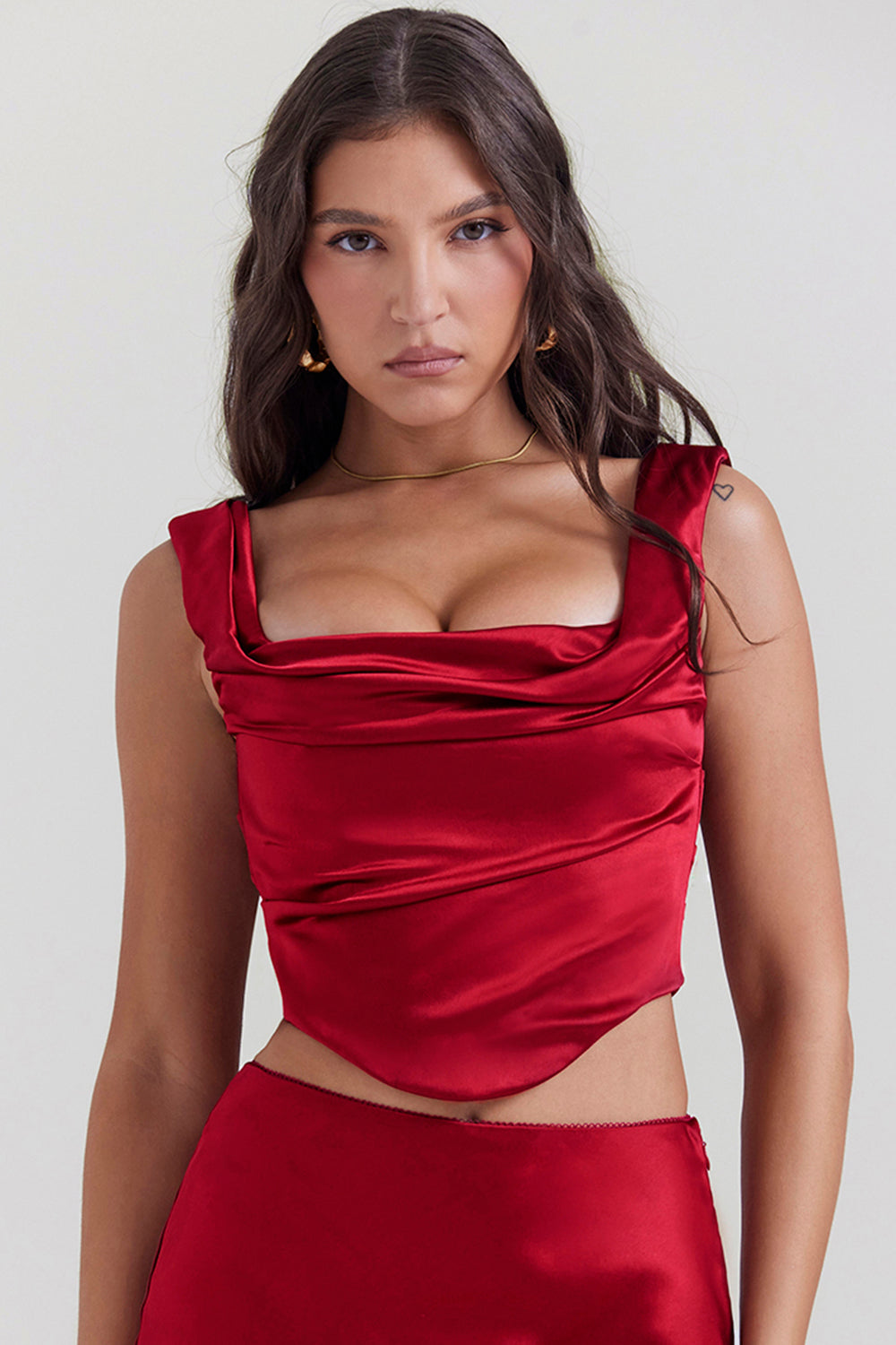 Set of ruby red corset with lace back and diagonally cut satin maxi skirt